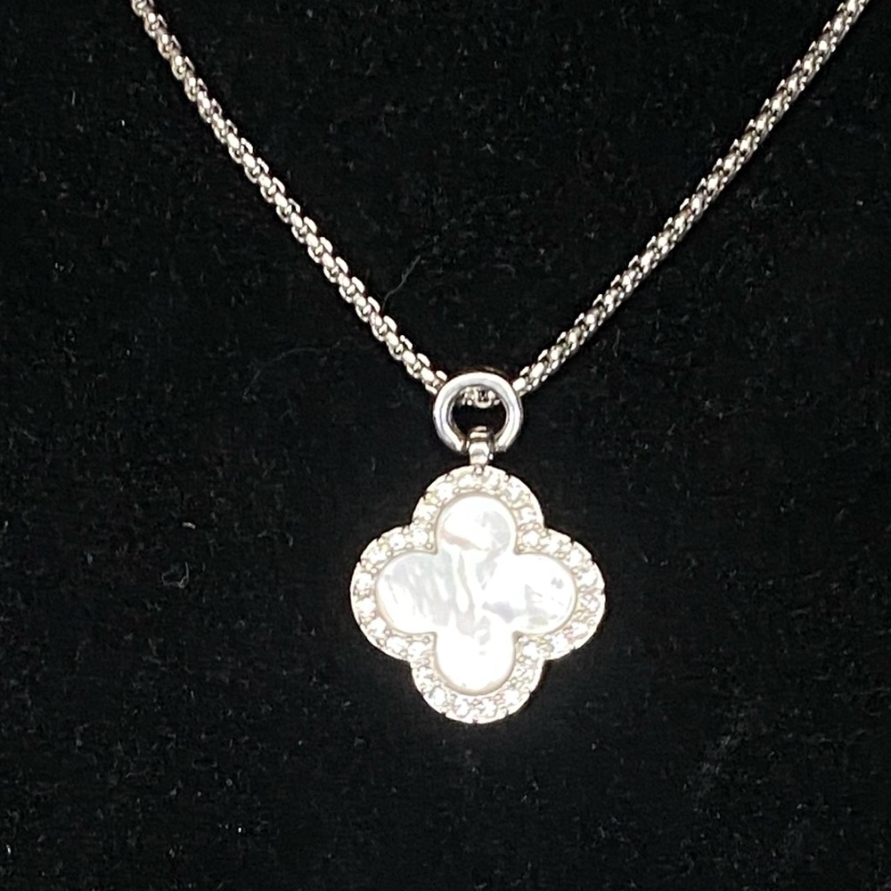 Alhambra clover motif  in silver tone w/mother of pearl framed by white crystals